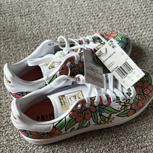 Adidas White and Green Sneakers with Artistic Design